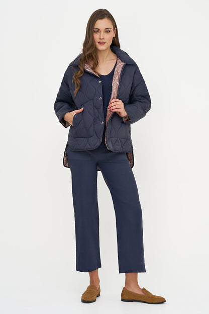 Women's Quilted Long Sleeve Jacket, with Front Patch Pockets & a Snap Closure System. Adorned with a Beautiful Snake Printed Lining