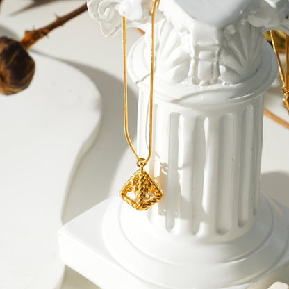 Style KARJAT: Gold Chain Necklace with Geometric Caged Zirconia Pendant